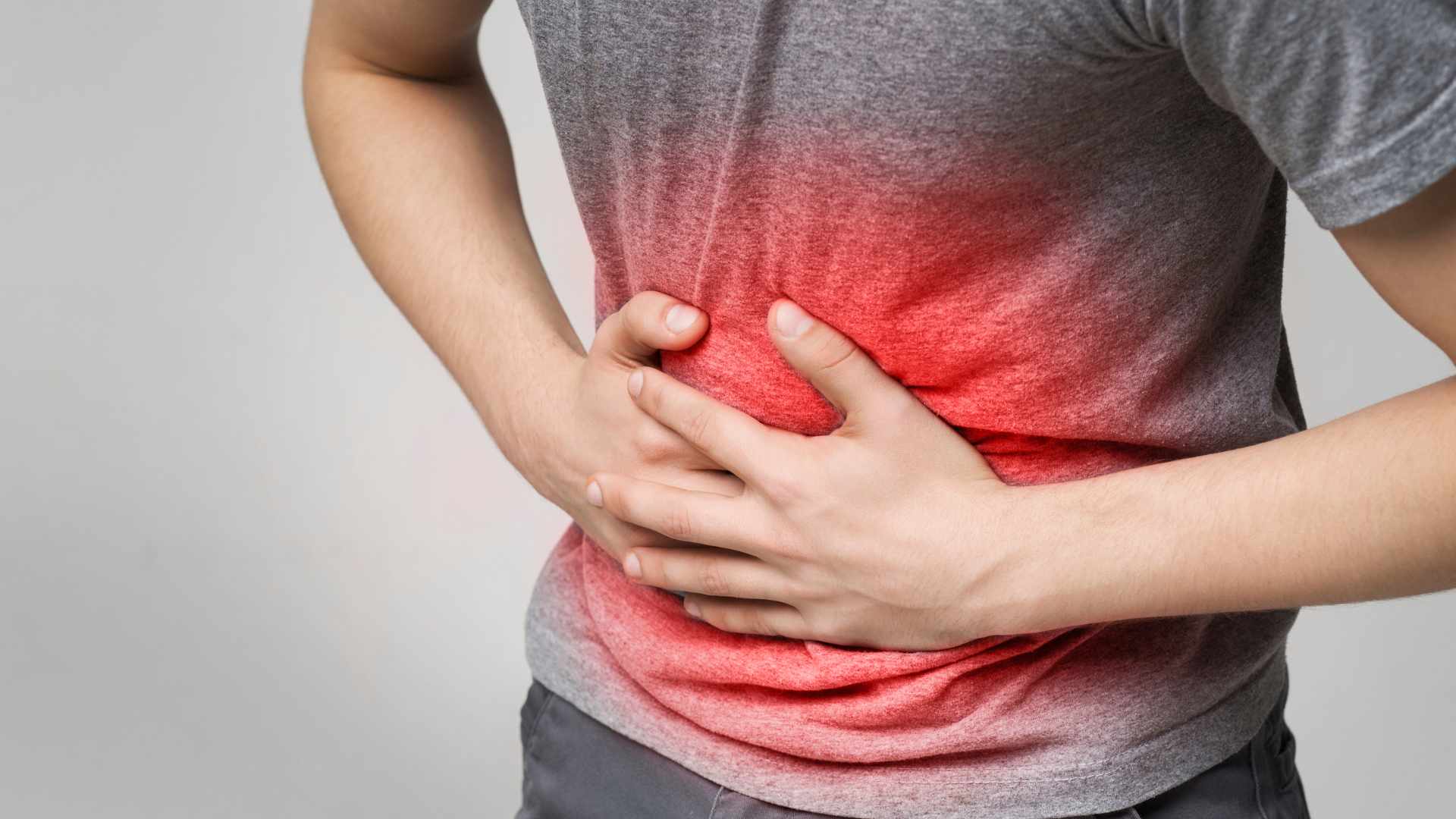 why is my stomach hard when i press on it